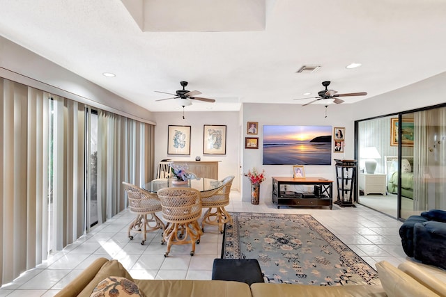 tiled dining area featuring ceiling fan