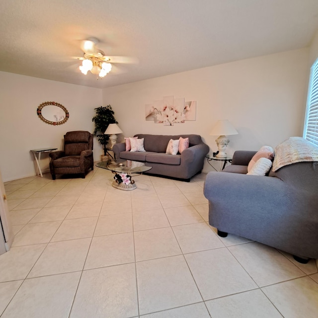 tiled living room with ceiling fan