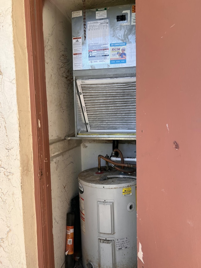 utility room featuring electric water heater