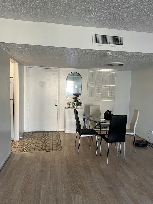 dining room with hardwood / wood-style floors