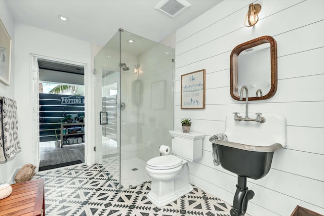 972 Marlin Dr, Jupiter, FL 33458 - bathroom featuring a shower stall, toilet, tile patterned floors, and visible vents