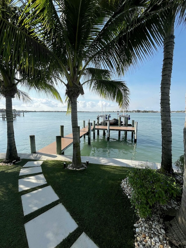 972 Marlin Dr, Jupiter, FL 33458 - view of dock featuring a yard and a water view