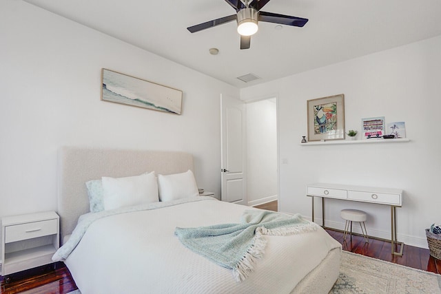 bedroom with dark wood-type flooring and ceiling fan