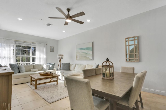 tiled living room with ceiling fan