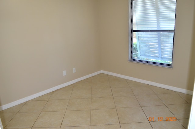 unfurnished room featuring light tile patterned floors