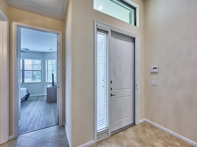 entryway featuring light tile patterned floors