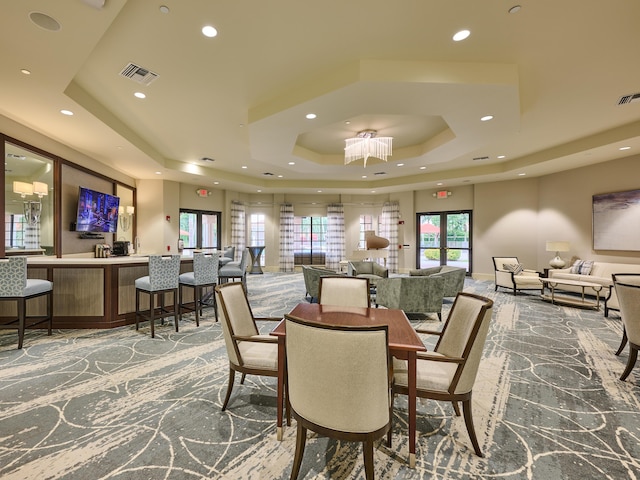 dining area featuring a tray ceiling