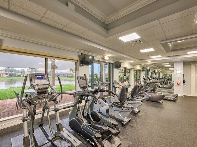 gym featuring a water view and a drop ceiling