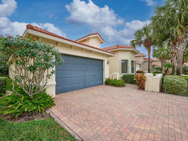 mediterranean / spanish house featuring a garage