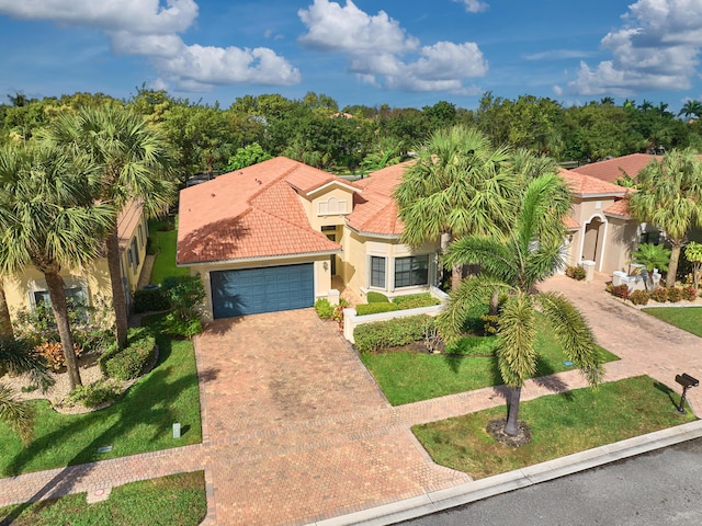 mediterranean / spanish-style home featuring a garage