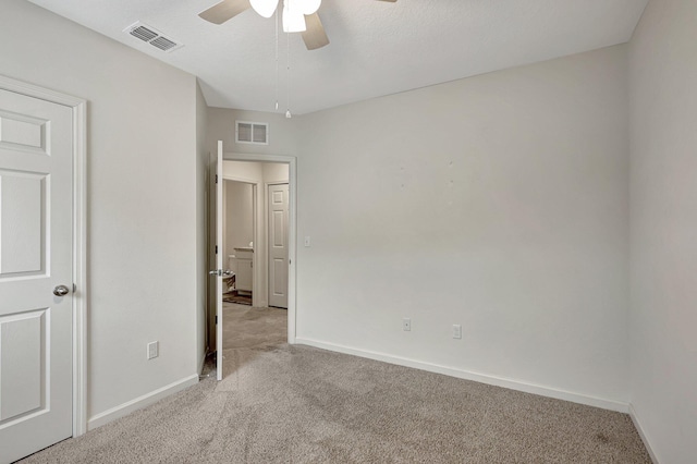 unfurnished bedroom with light colored carpet and ceiling fan