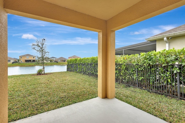 view of yard featuring a patio and a water view