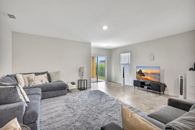 living room with light tile patterned floors