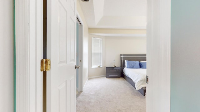 bedroom featuring light carpet