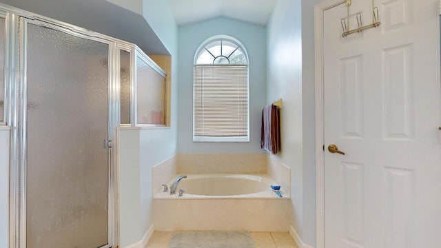 bathroom with vaulted ceiling, tile patterned floors, and separate shower and tub