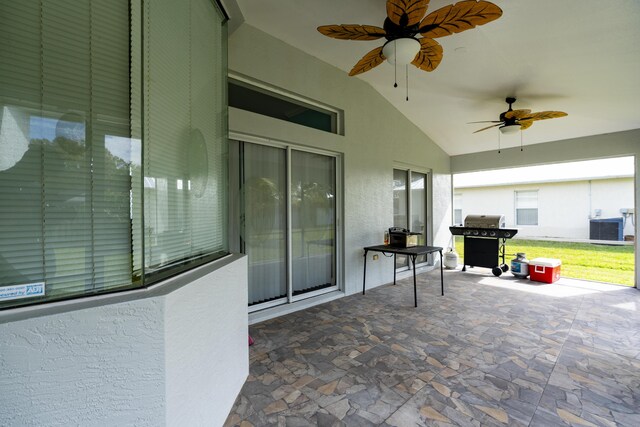 view of patio with ceiling fan and a grill