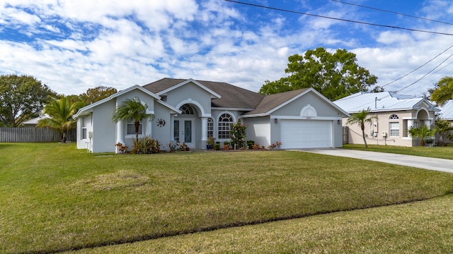 ranch-style home with a front lawn and a garage