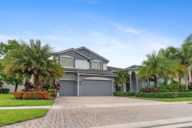 view of front of home with a garage