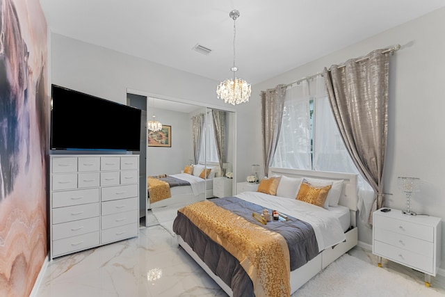 bedroom featuring a chandelier