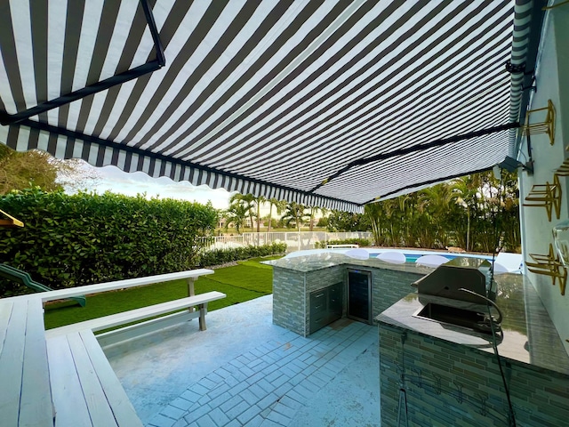 view of swimming pool with a lawn, a patio area, a grill, and area for grilling