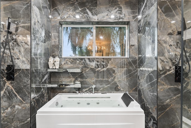 bathroom with a bathing tub and tile walls