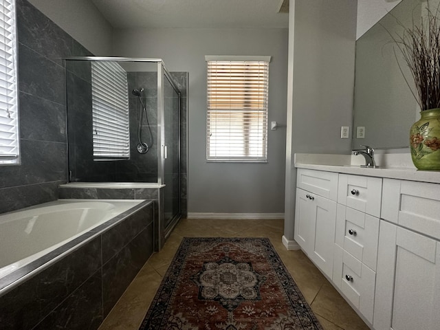 bathroom with tile patterned floors, vanity, and independent shower and bath