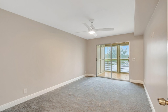 empty room featuring ceiling fan and carpet floors