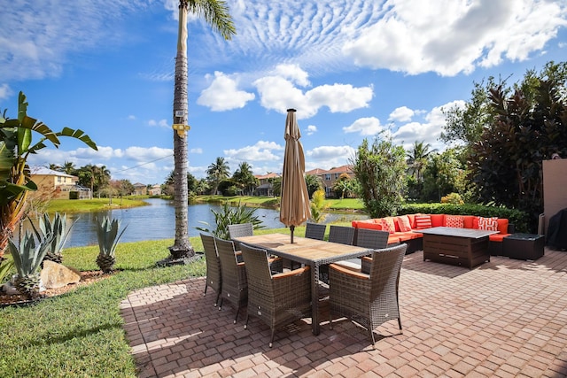 view of patio featuring an outdoor living space and a water view