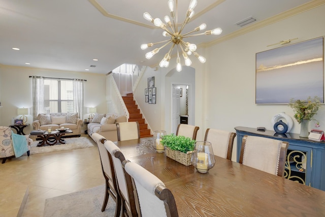 dining room with light tile patterned floors, crown molding, and an inviting chandelier