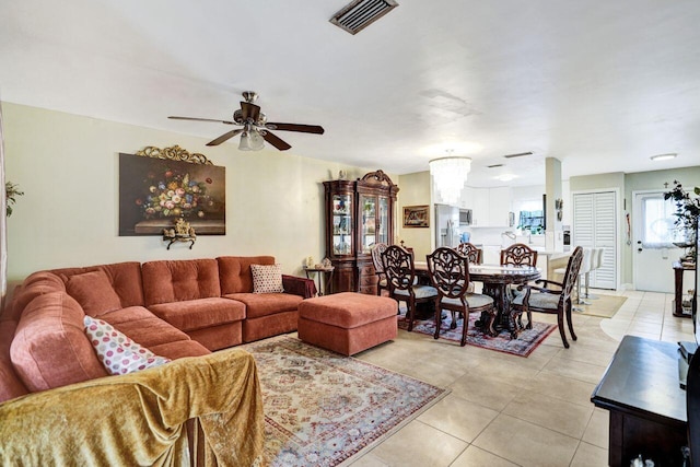 living room featuring ceiling fan and light tile patterned floors