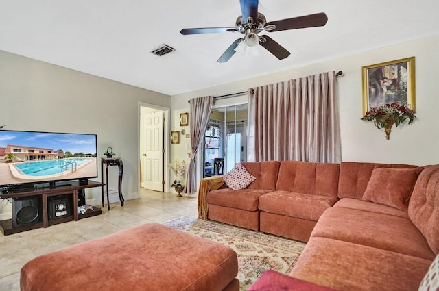 living room with ceiling fan and light tile patterned floors