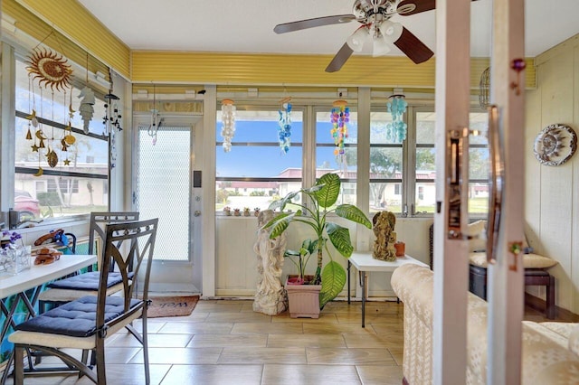 sunroom / solarium with ceiling fan