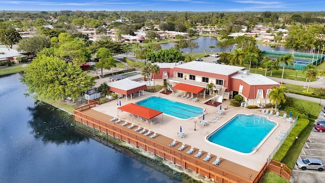 birds eye view of property with a water view