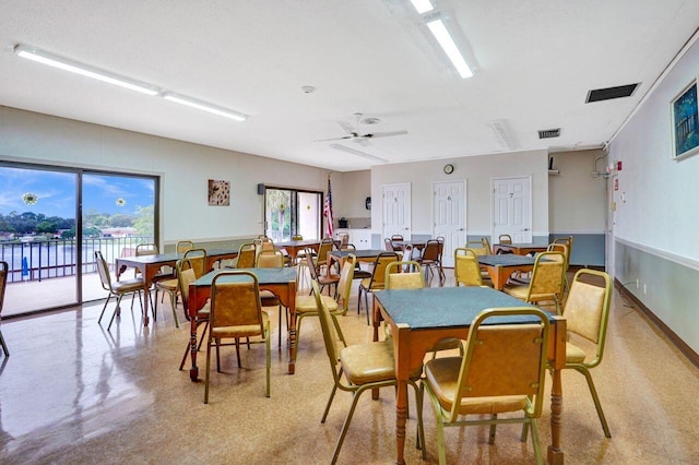 dining space featuring ceiling fan