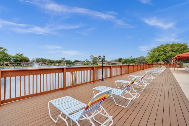 wooden deck featuring a water view