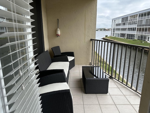 balcony featuring a water view