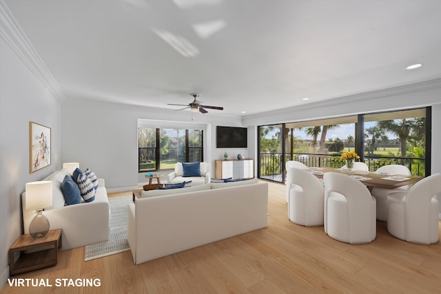 living room featuring crown molding, plenty of natural light, light hardwood / wood-style floors, and ceiling fan