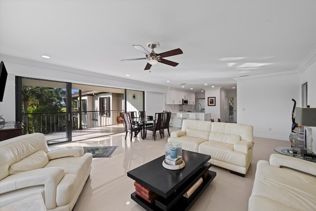 living room featuring crown molding and ceiling fan