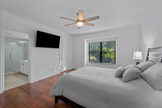 bedroom featuring ceiling fan, ensuite bathroom, crown molding, and wood-type flooring