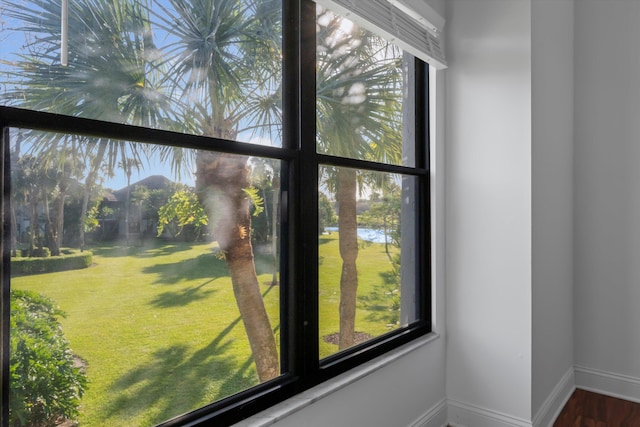 interior details with hardwood / wood-style flooring and a water view