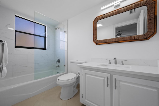 full bathroom with toilet, ceiling fan, tiled shower / bath, tile patterned flooring, and vanity