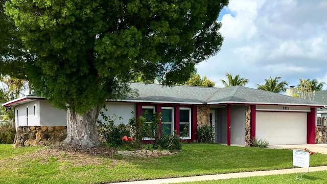 ranch-style home with a front yard, a chimney, a garage, stone siding, and driveway