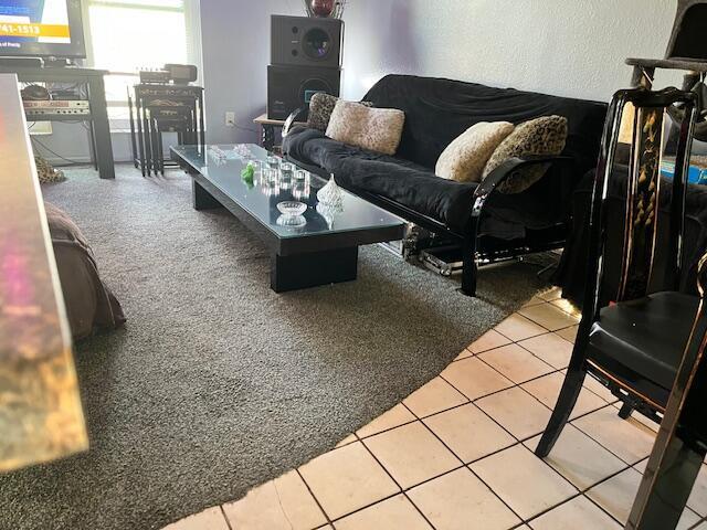 living room featuring light tile patterned flooring