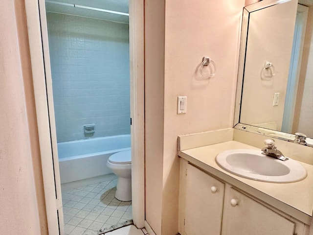 full bathroom with toilet, tile patterned flooring, tiled shower / bath combo, and vanity