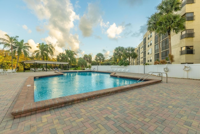 view of swimming pool with a patio