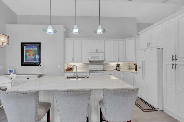 kitchen featuring white cabinetry, white appliances, and sink