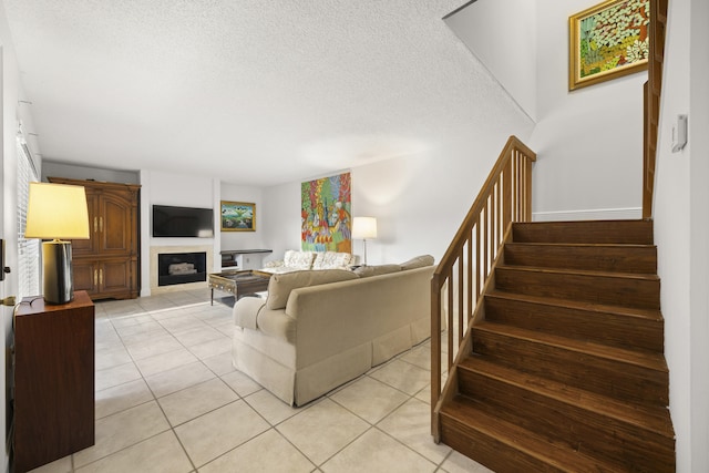 tiled living room with a textured ceiling