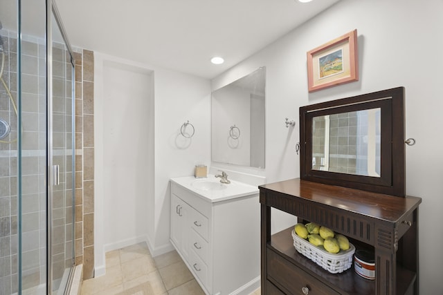 bathroom with tile patterned flooring, vanity, and a shower with shower door