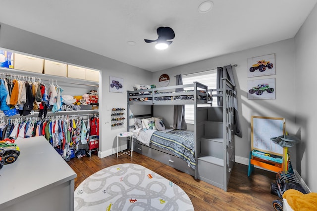 bedroom with dark wood-type flooring and a closet