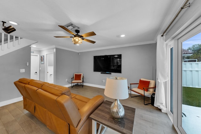 living room featuring ceiling fan and ornamental molding